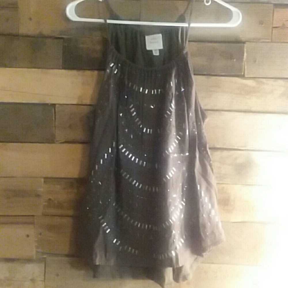 Green tank with silver embellishment.